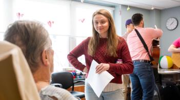 Student speaking with a patient
