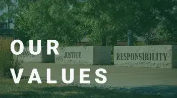 Display of the stones found on campus with words openness, justice, and responsibility engraved on them. With the text "Our Values" over it.