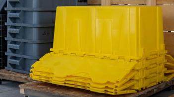 large plastic containers, stacked