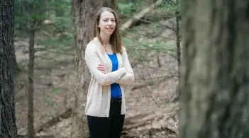 Emma poses in the woods