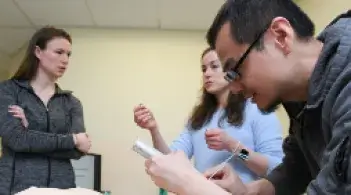 three students learning and talking