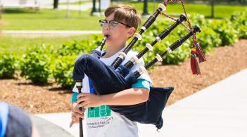 Kid playing the bagpipes 