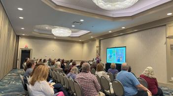 Audience listening to presentation at Gerontology Symposium