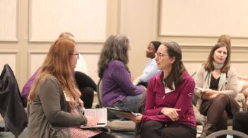 Group of people in conversation at a conference