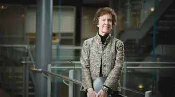 woman standing and smiling