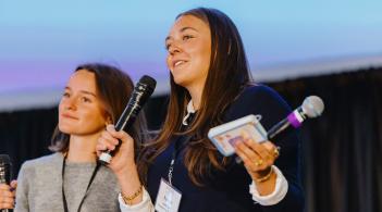 Two students present on stage