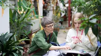 Instructor and student in botanical drawing class