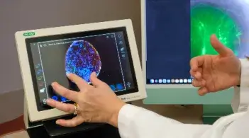 hands of people working with computer imaging