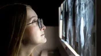 person looking at imaging on screen