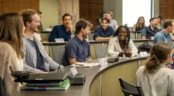 students sitting and chatting in classroom