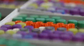 Capped test tubes in a rainbow of colors