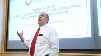 man standing in front of presentation screen