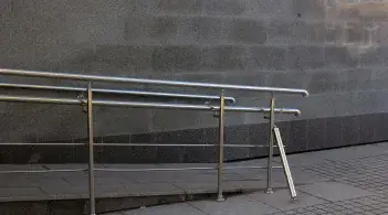 A ramp with a hand-rail leading upwards