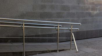 A ramp with a hand-rail leading upwards