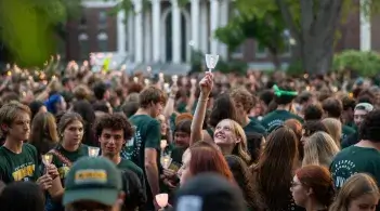 Students holding candles at Twilight Induction