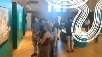 Visitors look at art in the Fleming's 'Belonging' gallery.