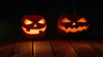 two lit-up jackolanterns 