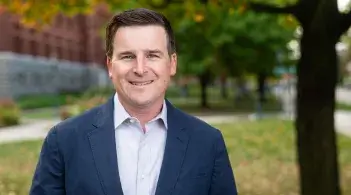 A headshot of Alex Garlick