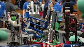 robots from the 2025 FIRST New England competition in the arena