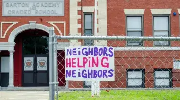 Sign saying neighbors helping neighbors