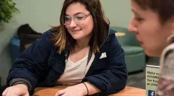 An advisor in the UVM Career Center helping a student