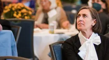 person in audience listening intently