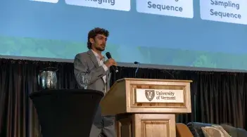 Student speaking at a podium