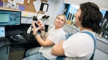 two women working at a computer