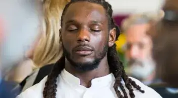 Person with closed eyes meditating
