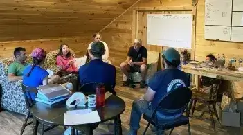 a group of people meeting indoors