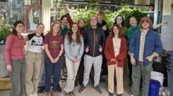 A group of students standing in the ecodesign space in the Rubenstein School