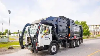 A Casella truck on UVM's campus parked near Billings Lecture Hall