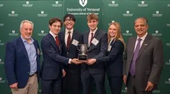 The SUNY Plattsburgh team holding the trophy after their first place win at the Grossman Dean's Cup