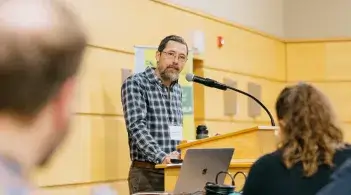 Micheal Moser speaking to an audience 