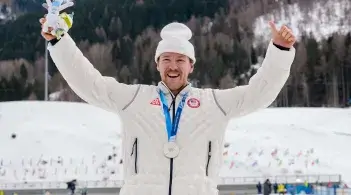 UVM alum Ben Ogden receiving a silver medal at the 2026 Olympics