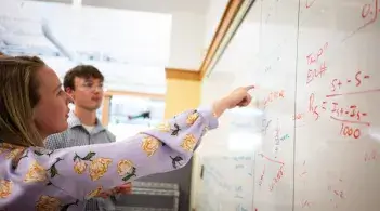 Barretscholar_ethan in front of whiteboard