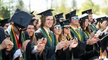 A line of graduates in cap and gown