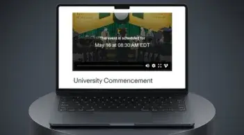 A laptop displays the Commencement video