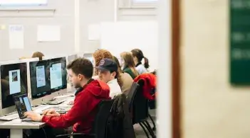 Students in front of computers in a classroom