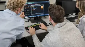 students working on computer