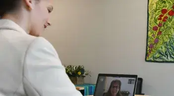 woman on laptop having a video conference