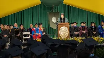 Mark DeMichaelis speaks to Grossman School of Business graduates at the 2026 commencement