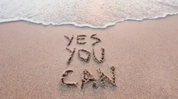 Writing in the sand "yes you can"