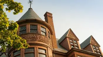 a historic brick building against a blue sky