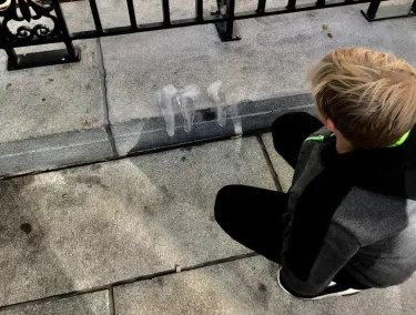 Kid watching ice sculpture