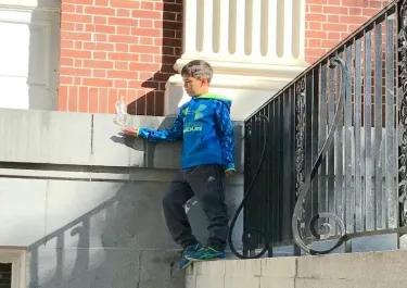 Kid holding a ice sculpture on his hand