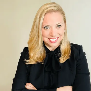Headshot of woman with long blonde hair