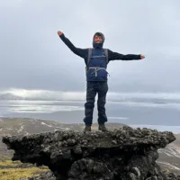 Brody Brown on top of a mountain