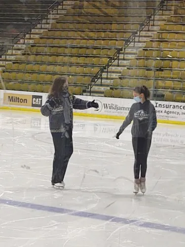 Pat Stokowski instructing a student on the ice