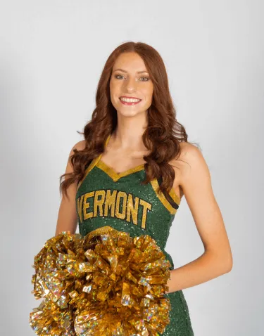 Girl in a UVM Dance club outfit